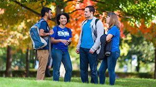 Students standing on campus Students standing on campus