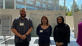 Project SEED Student presenting to a group of SHU Undergraduate and Graduate students. Prof. Joseph Badillo (left), SEED Student Dayannara Vilcarino from Jose Marti Academy in Union City (middle), and Seton Hall Graduate Student Zena Salem (right).