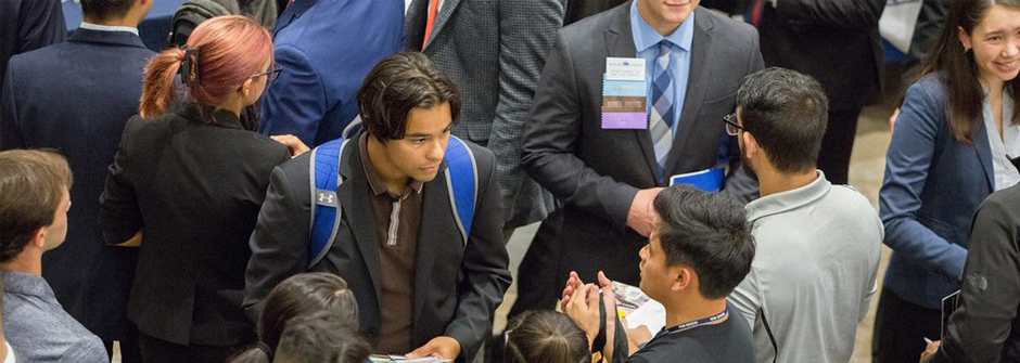 Image of students at the career fair in a crowd. 