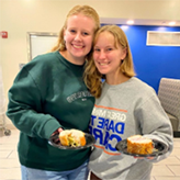 two female students with food