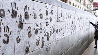 Hand prints on a wall in support of Alexei Navalny