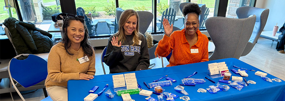 Three Human Resources employees tabling in the University Center