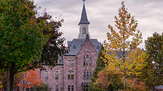 A photo of President's Hall in the fall.