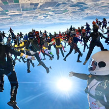 Image of a group of people sky diving. 